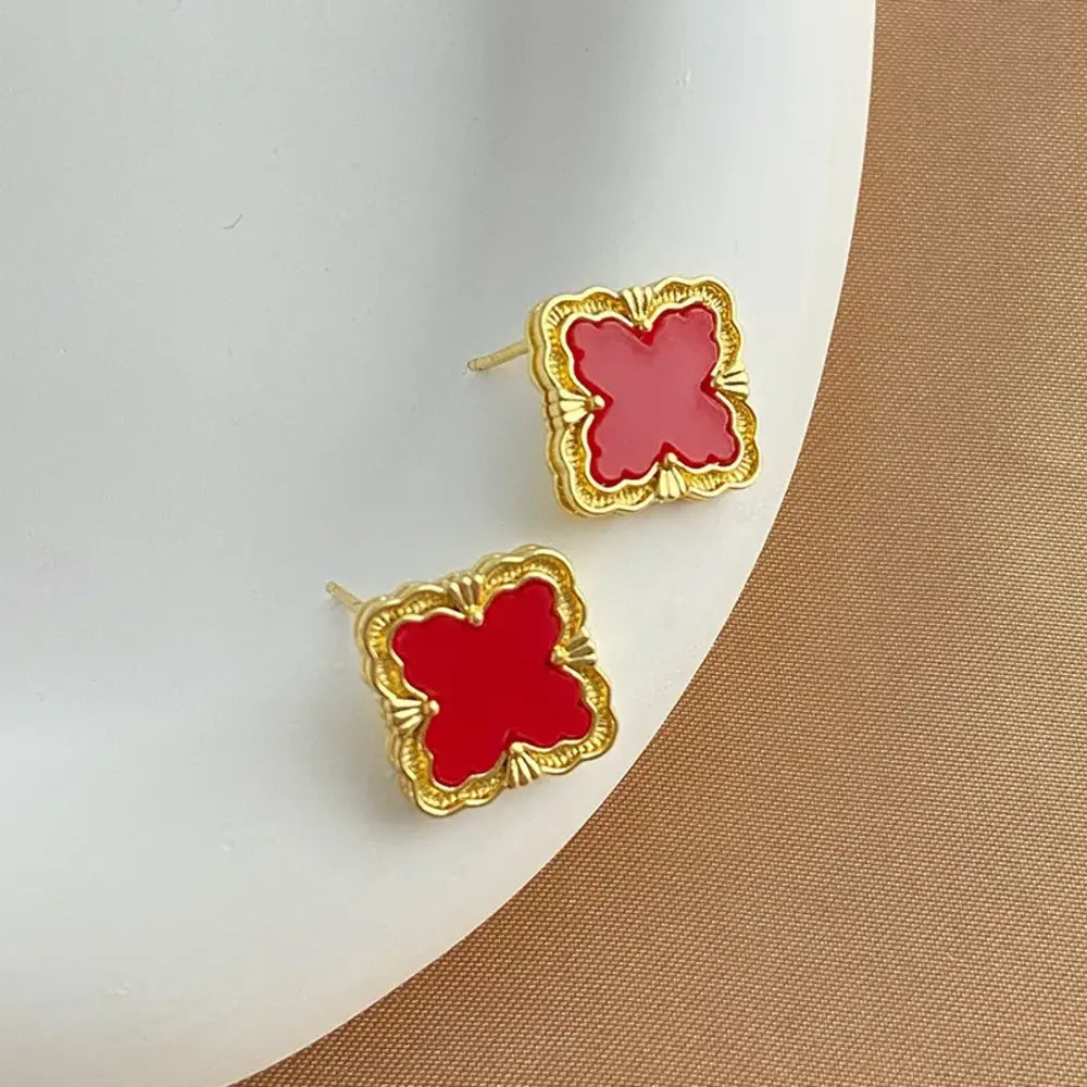 
  
  Quatrefoil Stud Earrings
  
