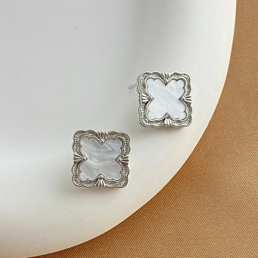 
  
  Quatrefoil Stud Earrings
  
